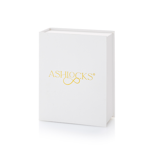 A white rectangular Ashlocks gift box with gold foil branding on the front, shown on a clean white background.