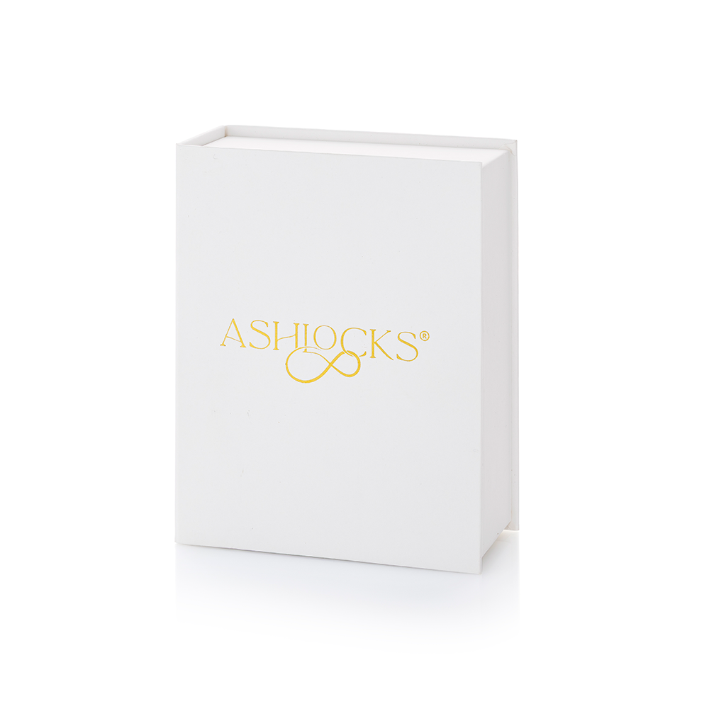 A white rectangular Ashlocks gift box with gold foil branding on the front, shown on a clean white background.