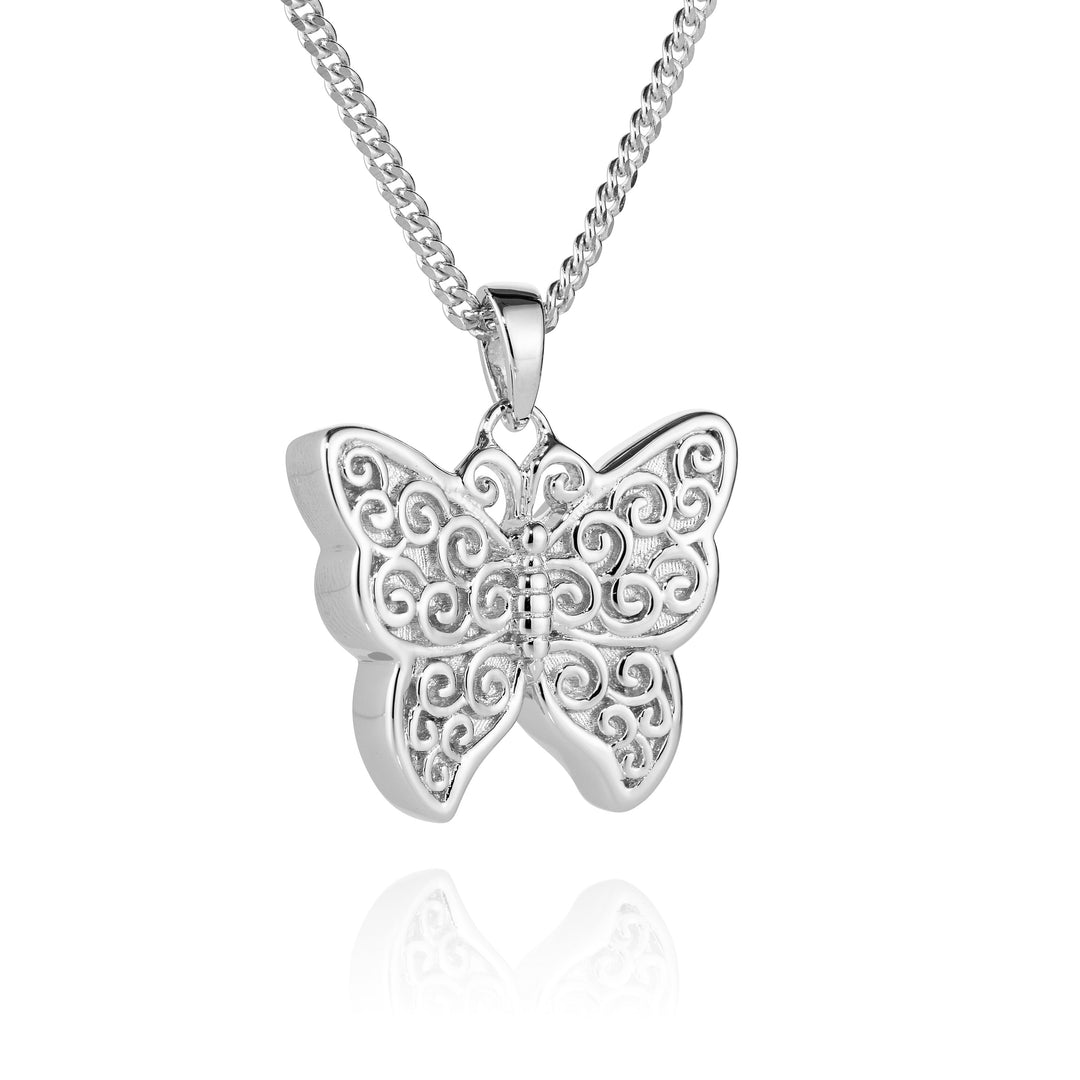 silver patterned butterfly hanging on a chain on a white background