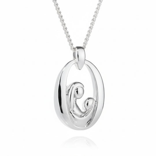 Silver necklace with a circular pendant on a white background