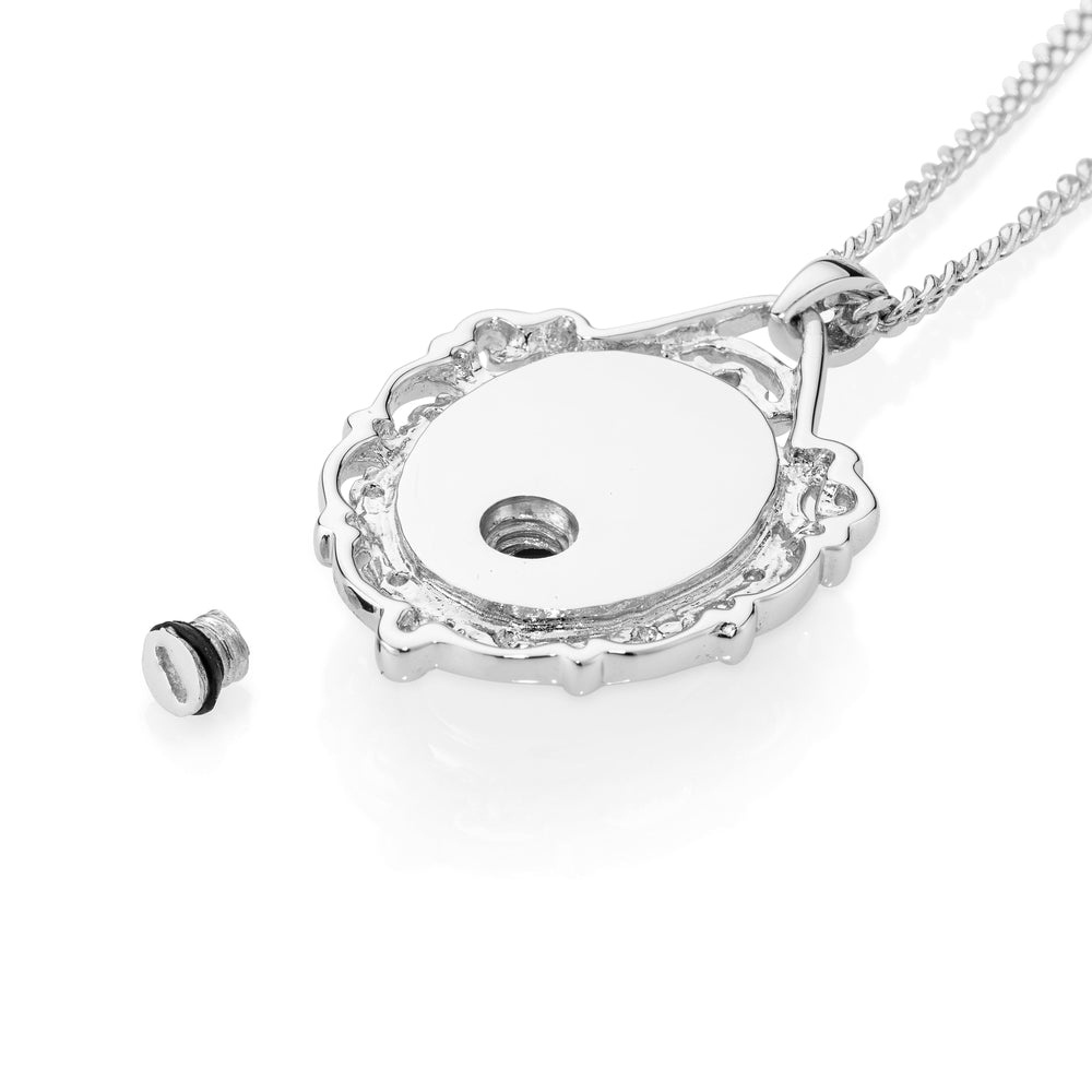 Silver necklace with a oval-shaped pendant on a white background