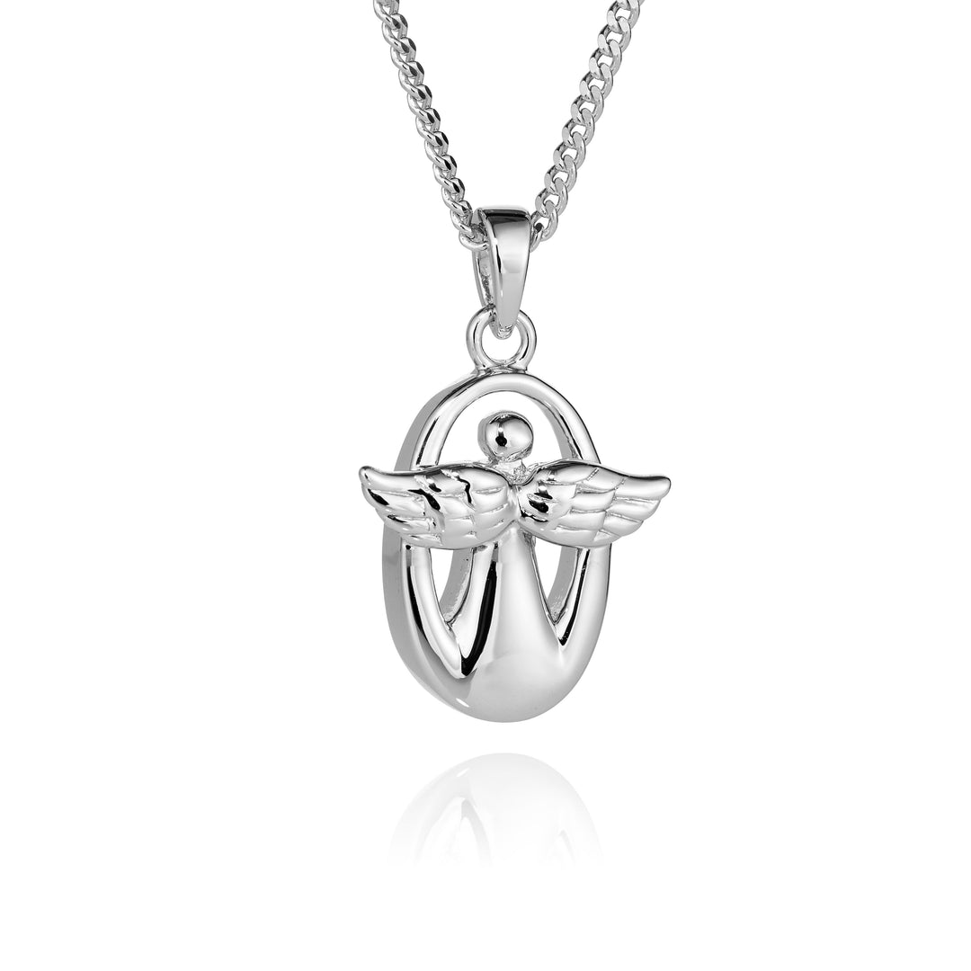A polished silver pendant necklace featuring a stylized angel with wings inside an oval frame, suspended from a silver chain against a white background with a soft reflection below.