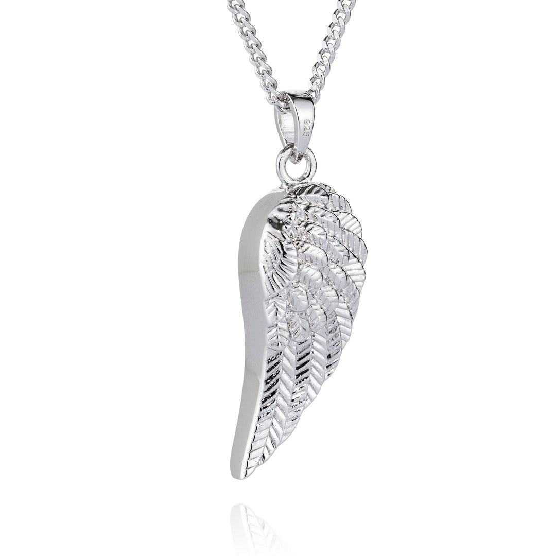 A silver angel wing pendant necklace on a matching silver chain, shown against a plain white background with a subtle reflection below.