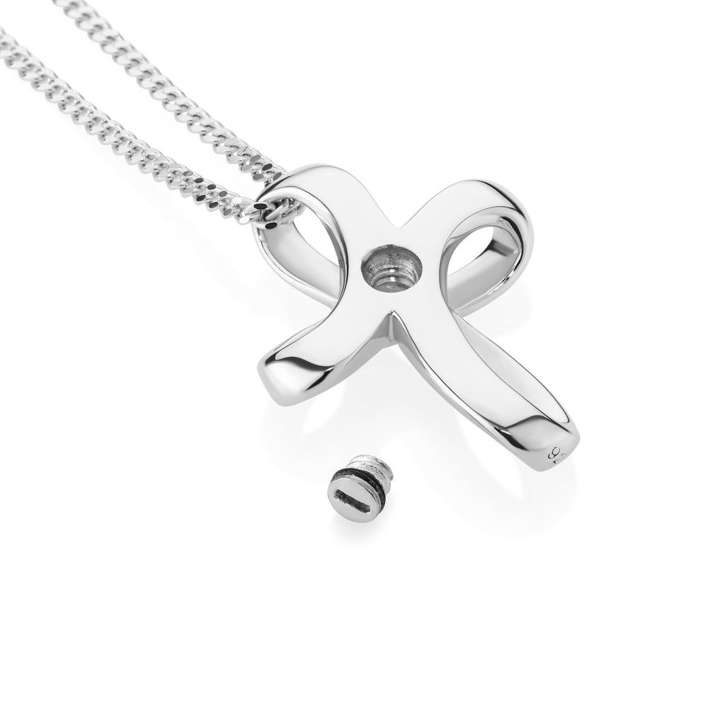 silver cross with open screw lying one a white background