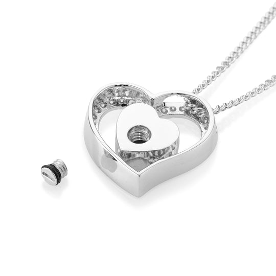 Silver heart-shaped pendant on a white background