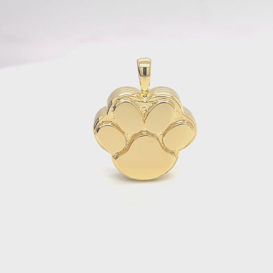gold paw print rotating video clip on a white background