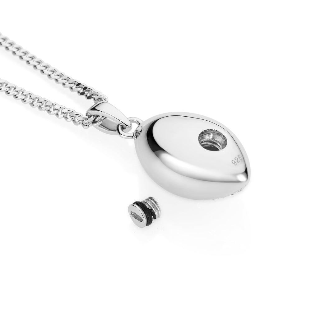 Silver necklace with a heart-shaped pendant on a white background