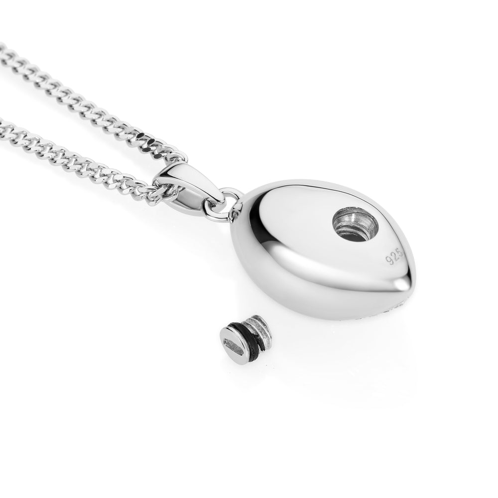Silver necklace with a oval-shaped pendant on a white background
