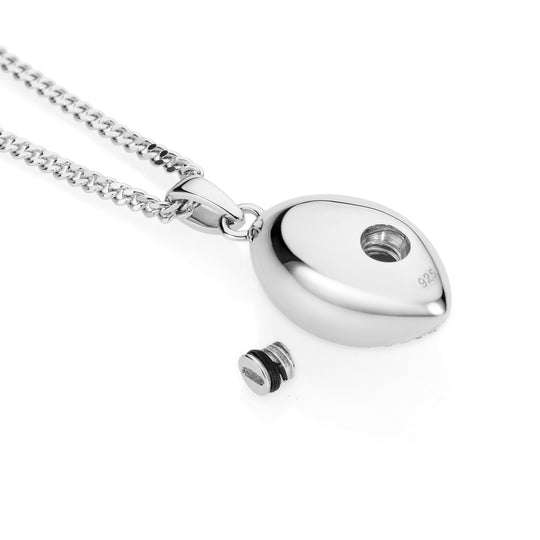 Silver necklace with a oval-shaped pendant on a white background