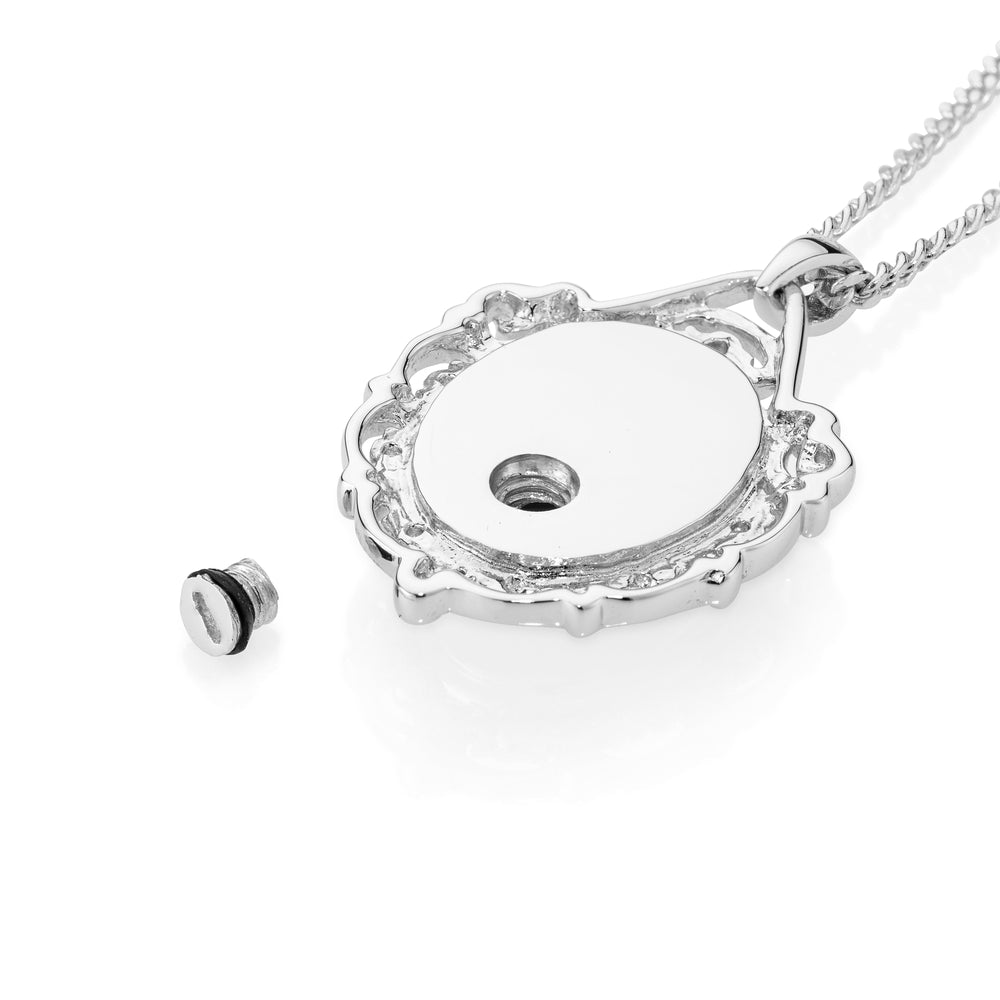 Silver necklace with a heart-shaped pendant on a white background