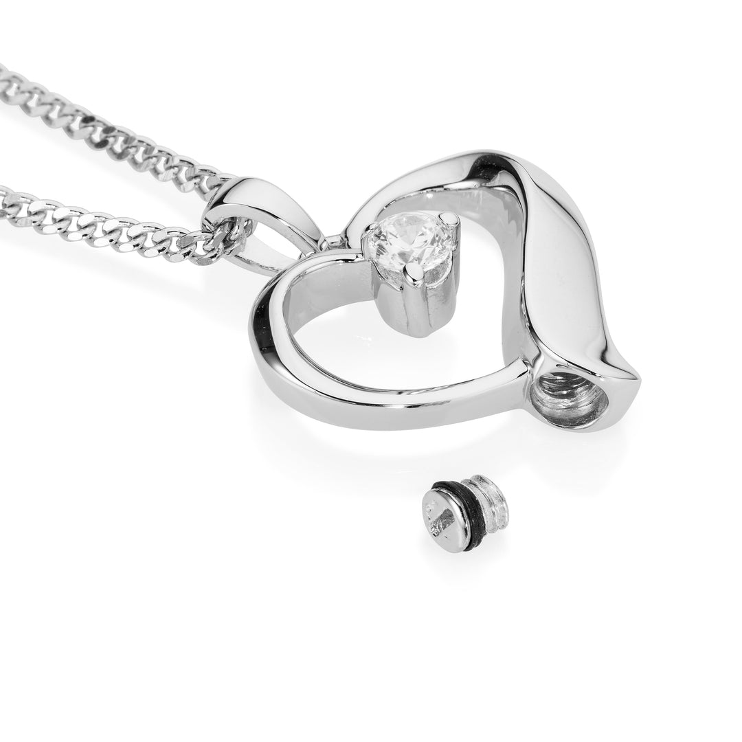Silver heart-shaped necklace with a diamond on a white background