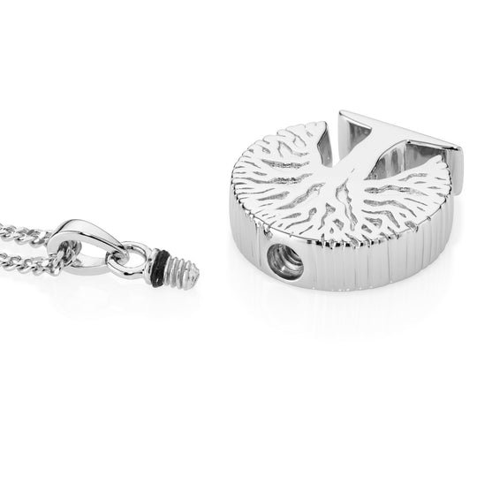 Silver pendant with chain on a white background